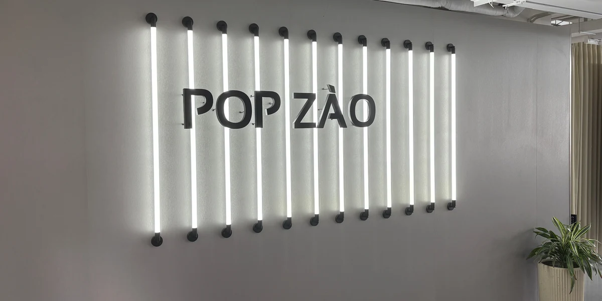 PopZao showroom with the POP ZÀO neon sign