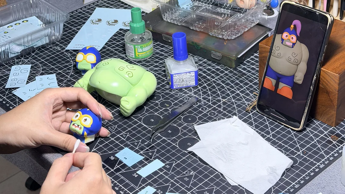 Applying water-slide decals to the figure